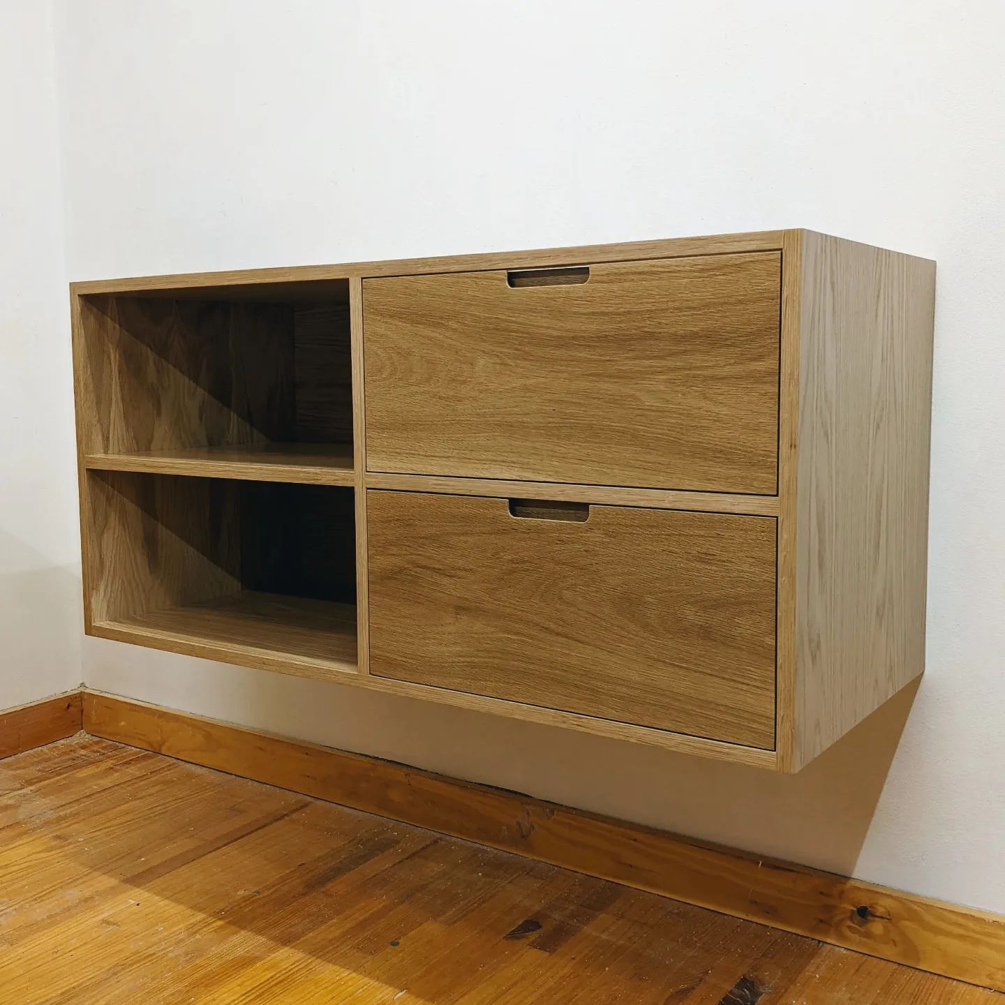April 11th, 2022: Just out the door is this floating white oak vanity! Once installed, this piece will be completed with a stone top and vessel sink.